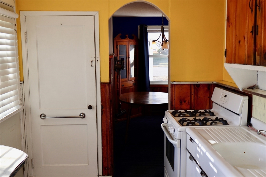 55 Blackstone Road Weymouth, MA 02191 - Photo 9 of 20 a kitchen with a refrigerator and a stove