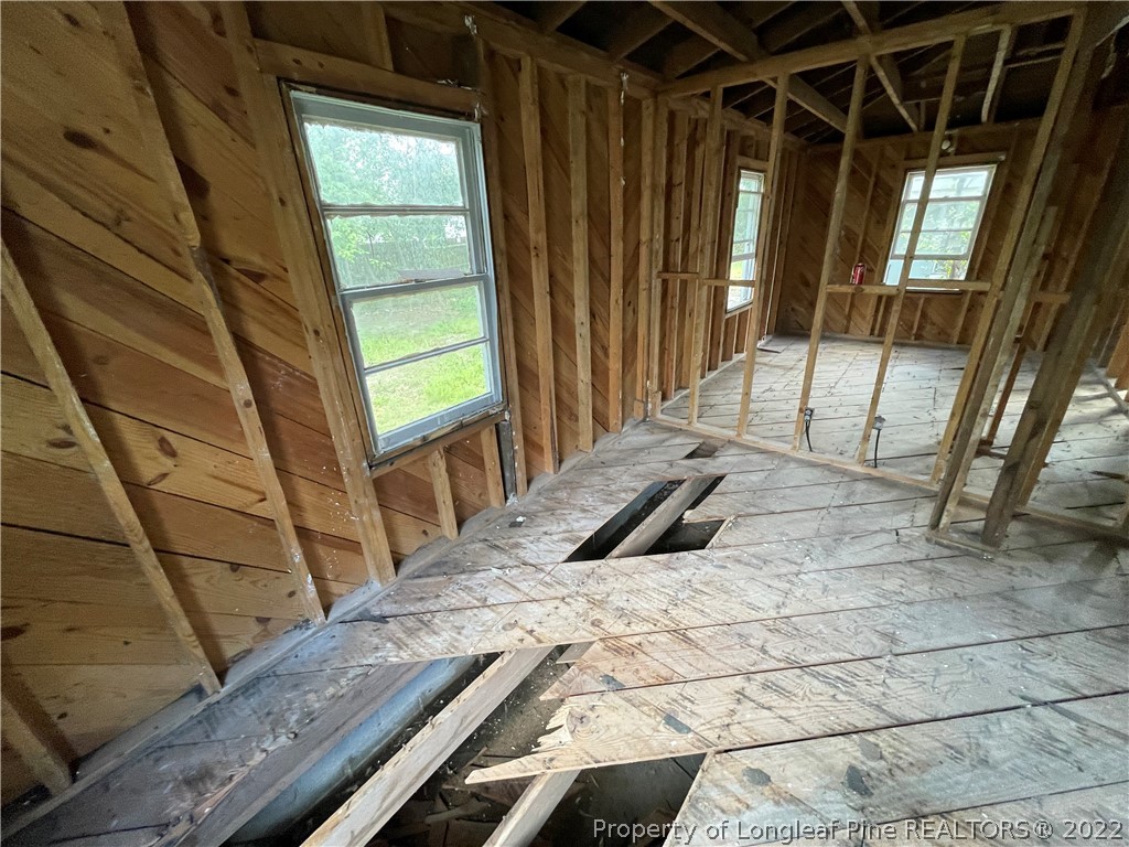 324 Rhew Street Fayetteville, NC 28303 - Photo 26 of 50 a bedroom with a bed and a window