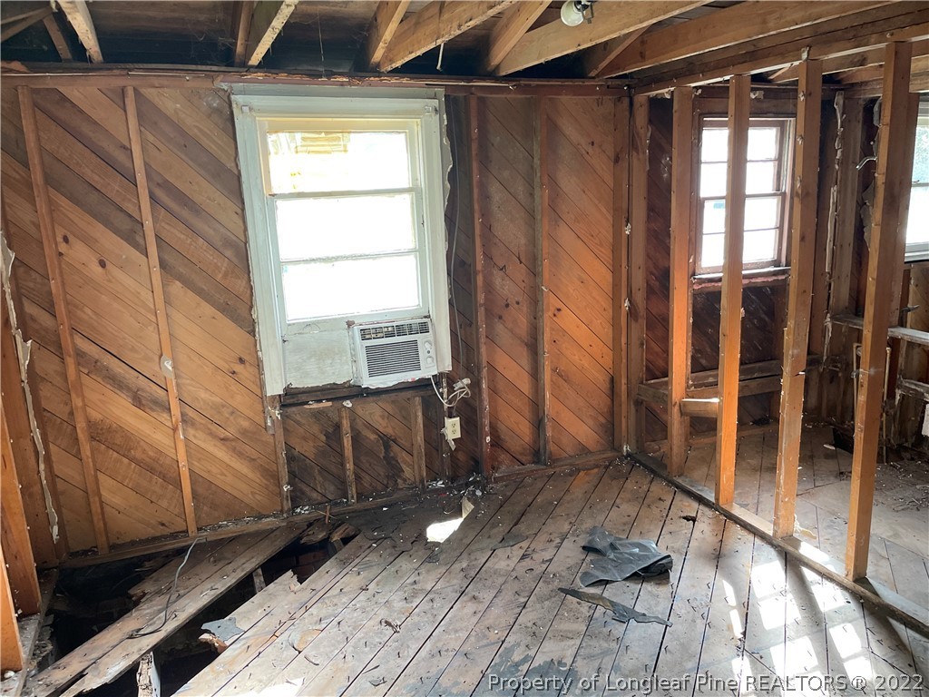 324 Rhew Street Fayetteville, NC 28303 - Photo 40 of 50 a room with wooden floor and furniture