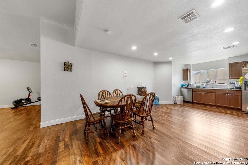 7131 Apache Converse, TX 78109 - Photo 7 of 14 a view of a dining room with furniture and wooden floor