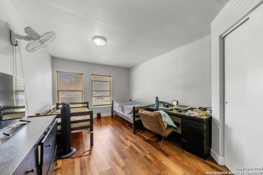 7131 Apache Converse, TX 78109 - Photo 8 of 14 a bedroom with furniture and a window