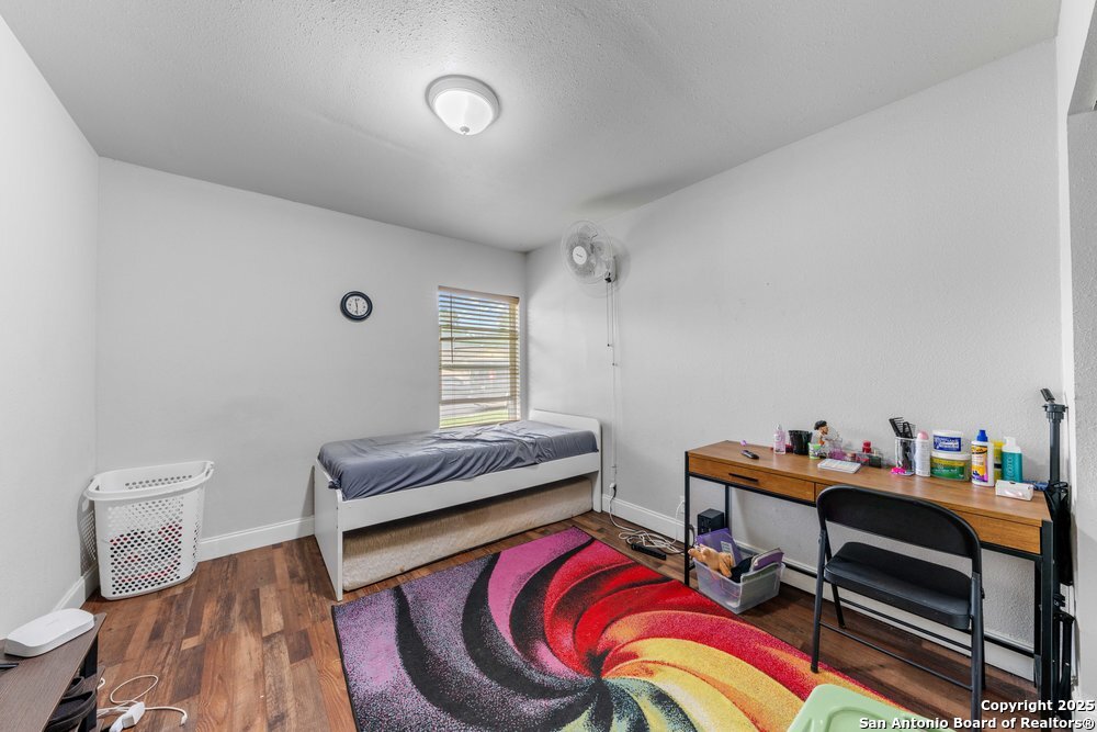 7131 Apache Converse, TX 78109 - Photo 9 of 14 a living room with furniture and a wooden floor