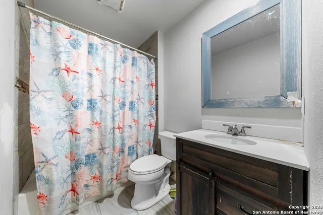 a bathroom with a sink and a toilet