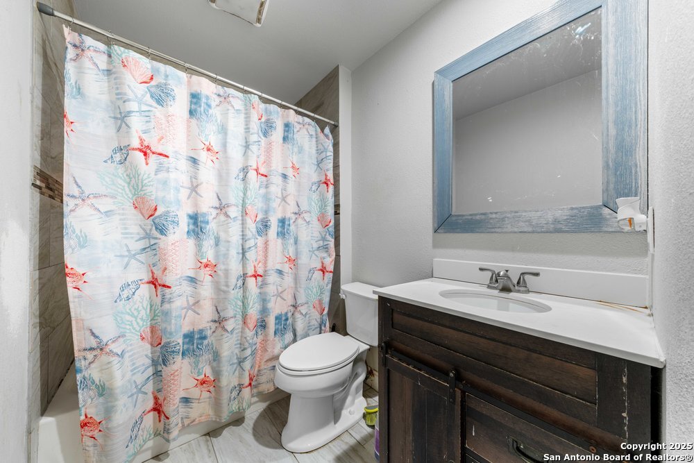 7131 Apache Converse, TX 78109 - Photo 10 of 14 a bathroom with a sink and a toilet