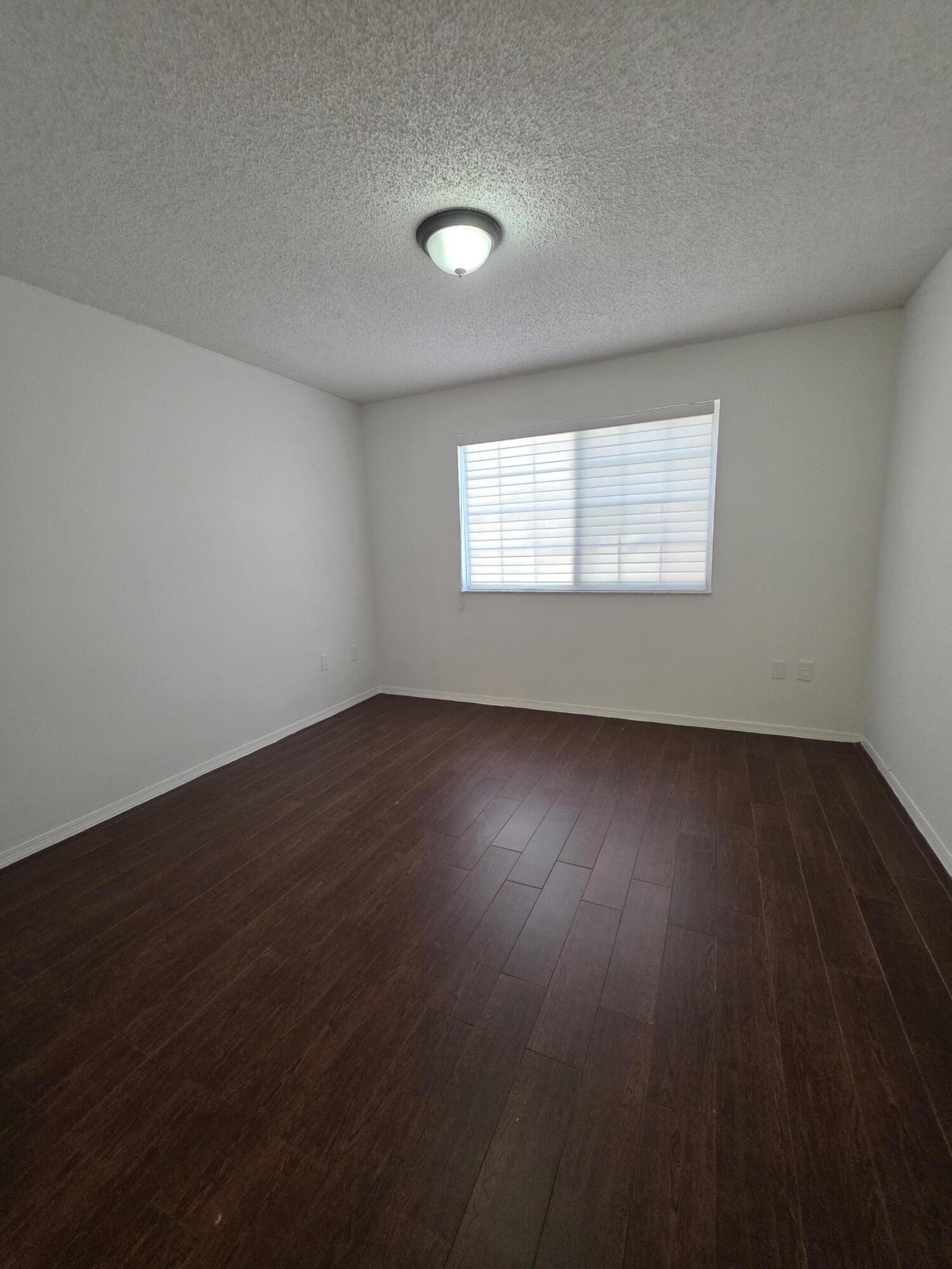 4175 Haverhill Road, Unit 907 West Palm Beach, FL 33417 - Photo 27 of 38 a view of room and hardwood floor