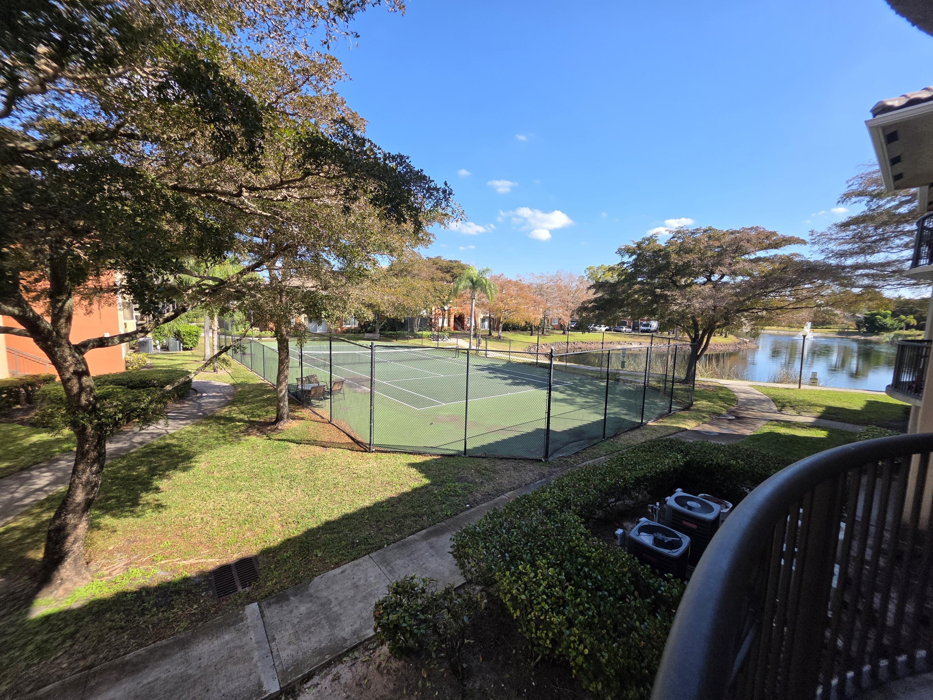4175 Haverhill Road, Unit 907 West Palm Beach, FL 33417 - Photo 9 of 38 a view of a park with large trees