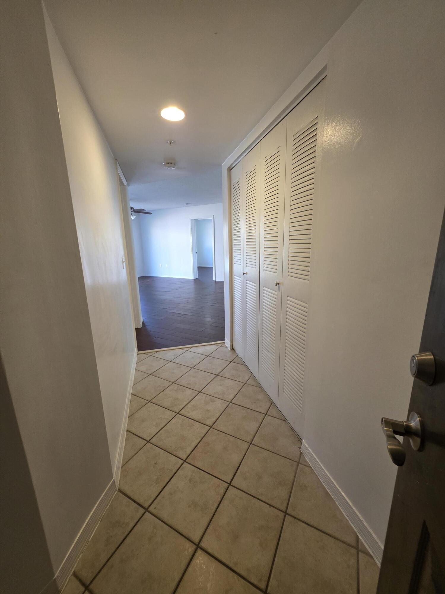 4175 Haverhill Road, Unit 907 West Palm Beach, FL 33417 - Photo 10 of 38 a bathroom with a sink and a mirror
