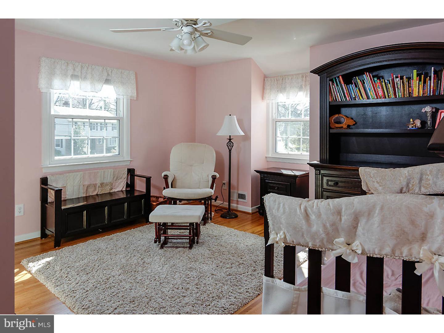 153 Pearl Croft Road Cherry Hill, NJ 08034 - Photo 22 of 25 a living room with furniture a window and a bookshelf