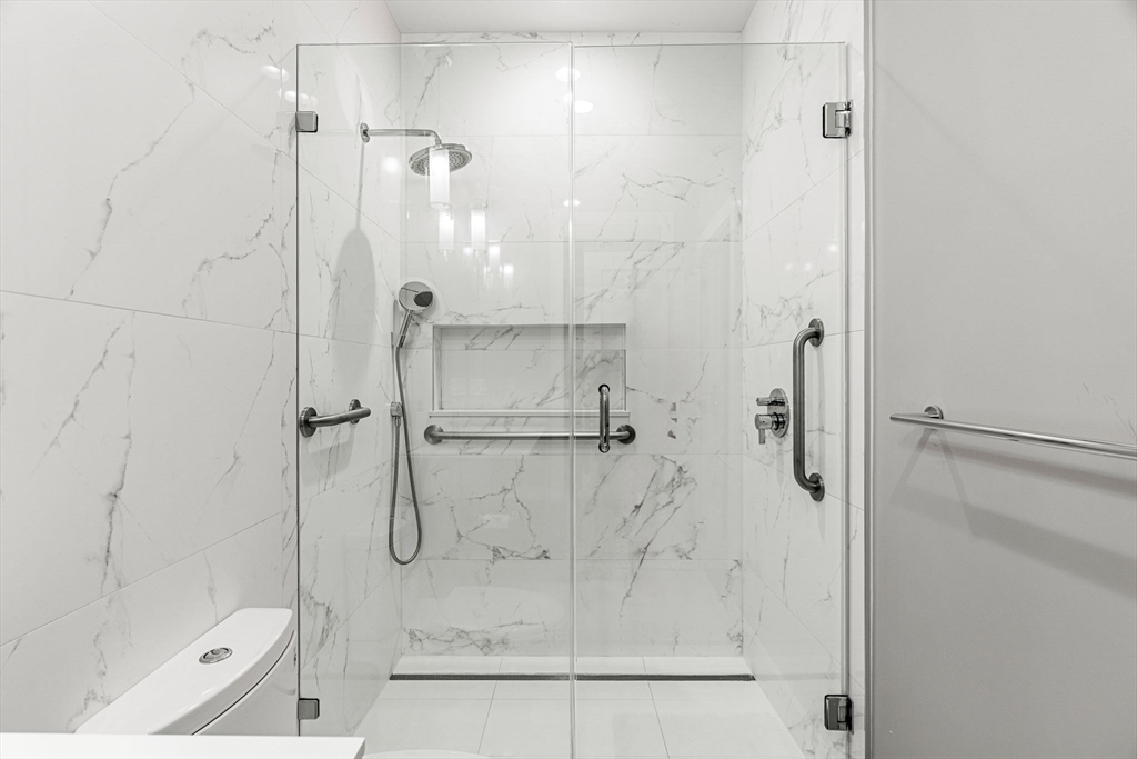 39 A Street, Unit 4 Boston, MA 02127 - Photo 16 of 28 a bathroom with a shower