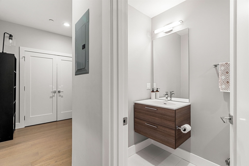 39 A Street, Unit 4 Boston, MA 02127 - Photo 20 of 28 a bathroom with a sink toilet and shower