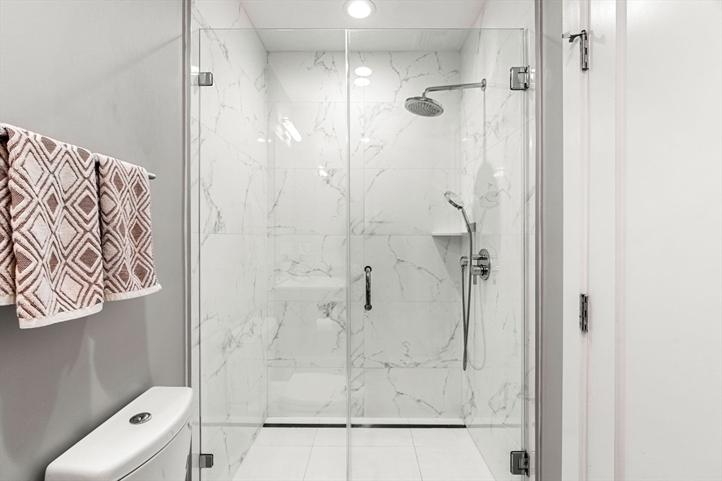 39 A Street, Unit 4 Boston, MA 02127 - Photo 21 of 28 a bathroom with a shower