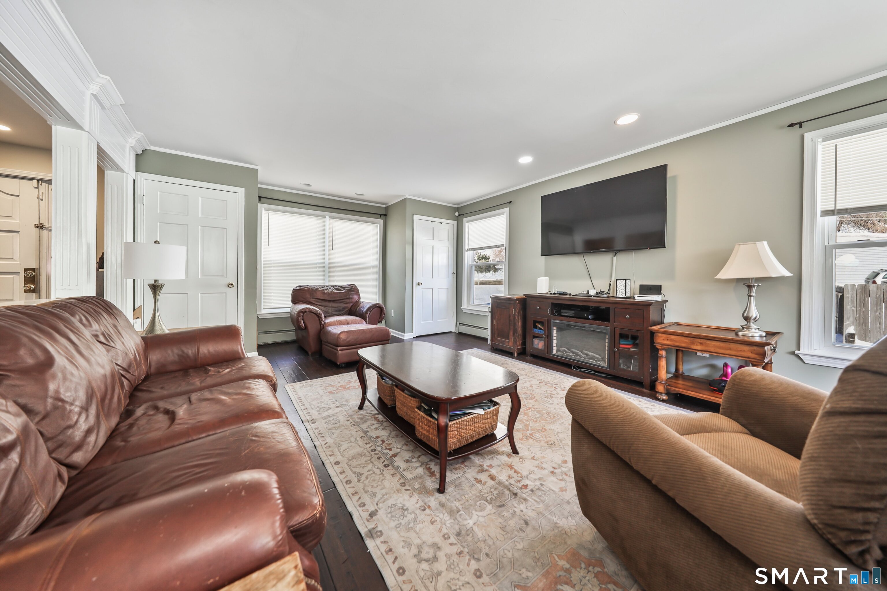 28 Beacon Street Beacon Falls, CT 06403 - Photo 12 of 38 a living room with furniture a flat screen tv and kitchen view