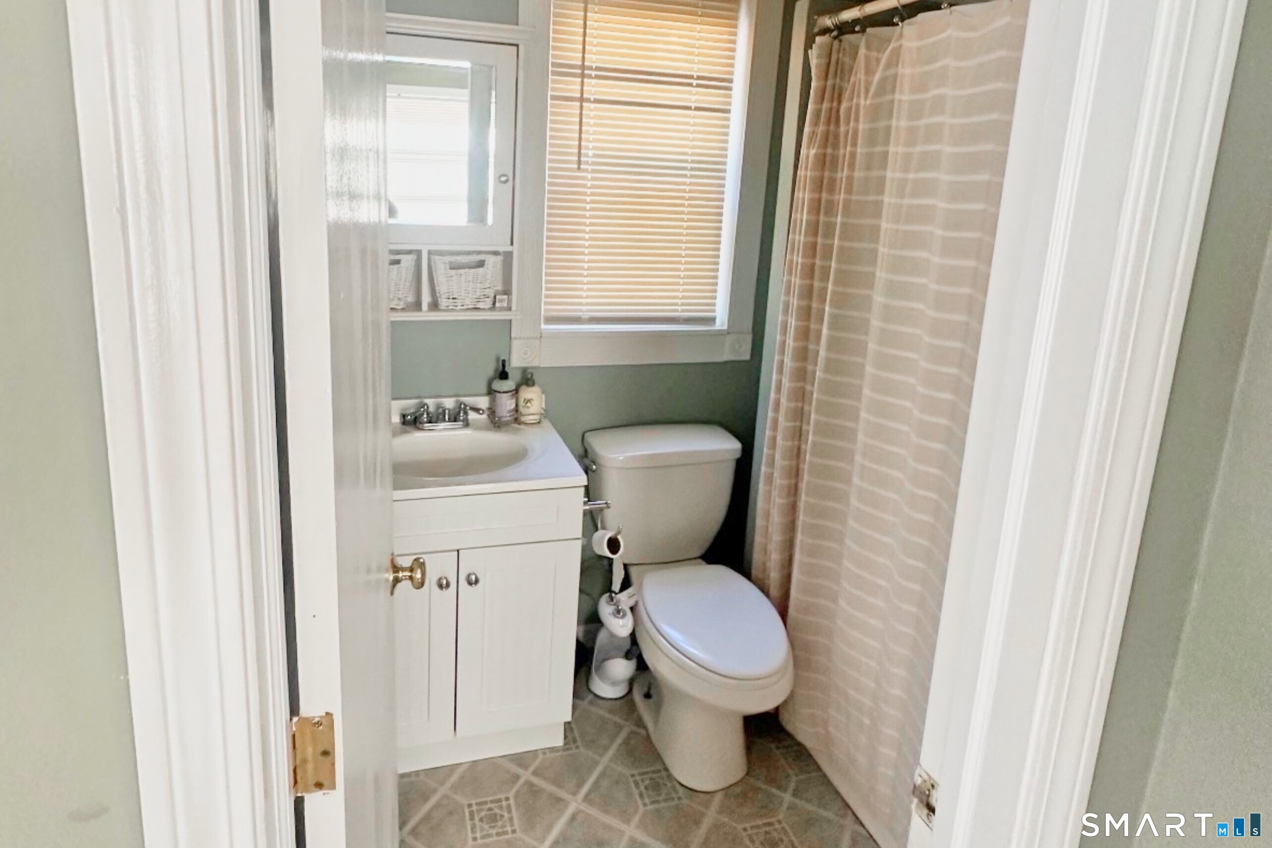 28 Beacon Street Beacon Falls, CT 06403 - Photo 4 of 38 a white toilet sitting next to a bathroom sink