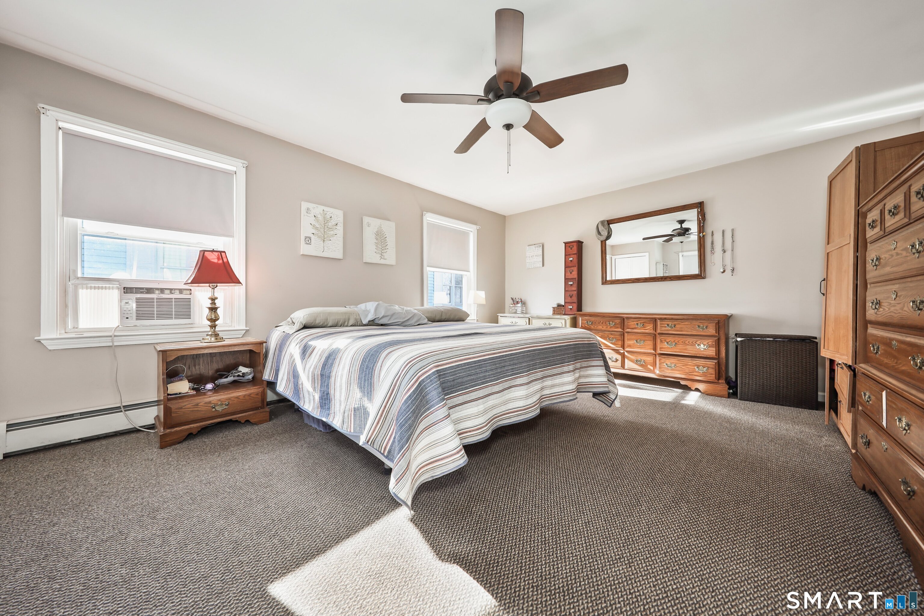 28 Beacon Street Beacon Falls, CT 06403 - Photo 6 of 38 a bedroom with a bed and a chandelier