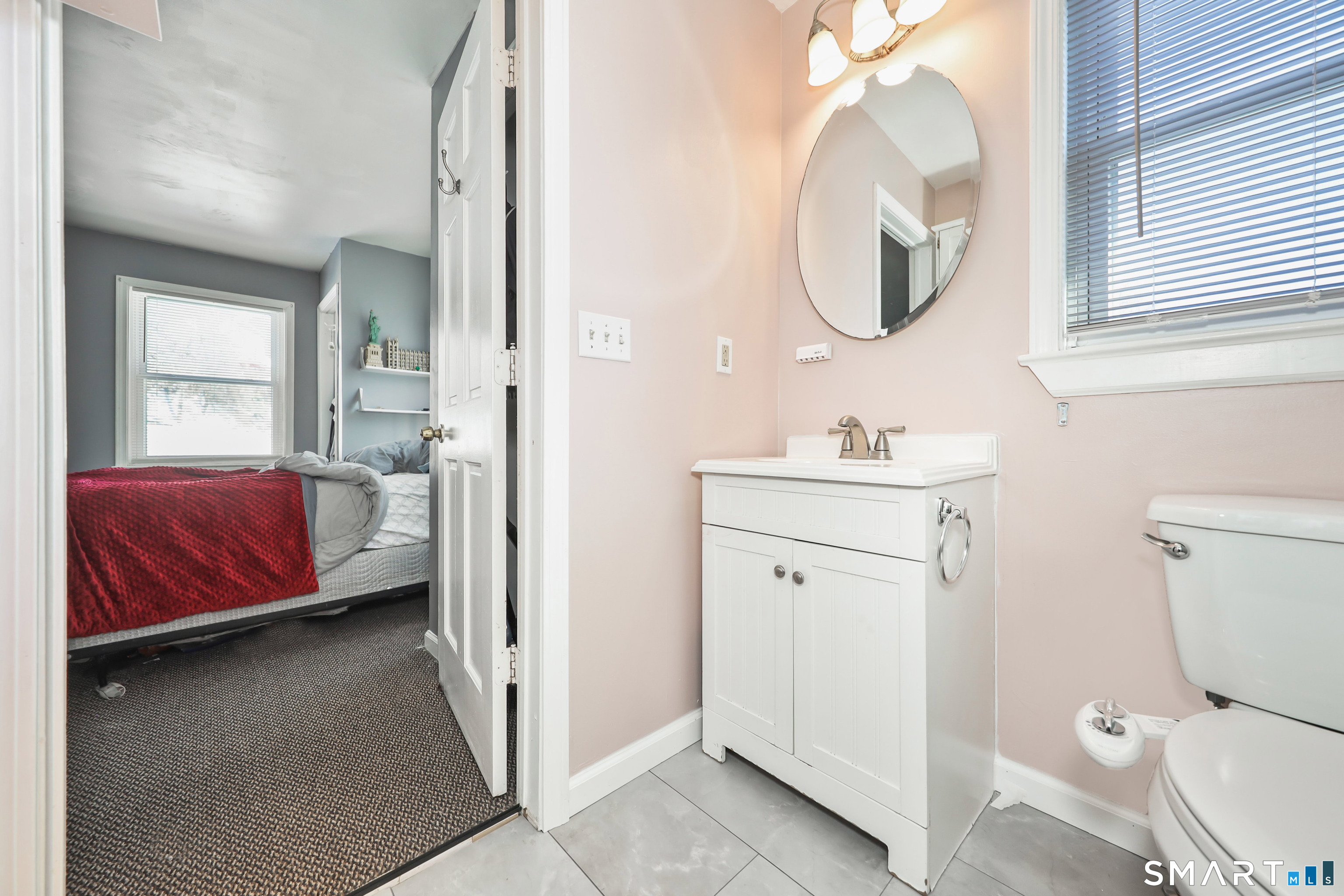 28 Beacon Street Beacon Falls, CT 06403 - Photo 8 of 38 a en suite bathroom with a toilet sink and mirror