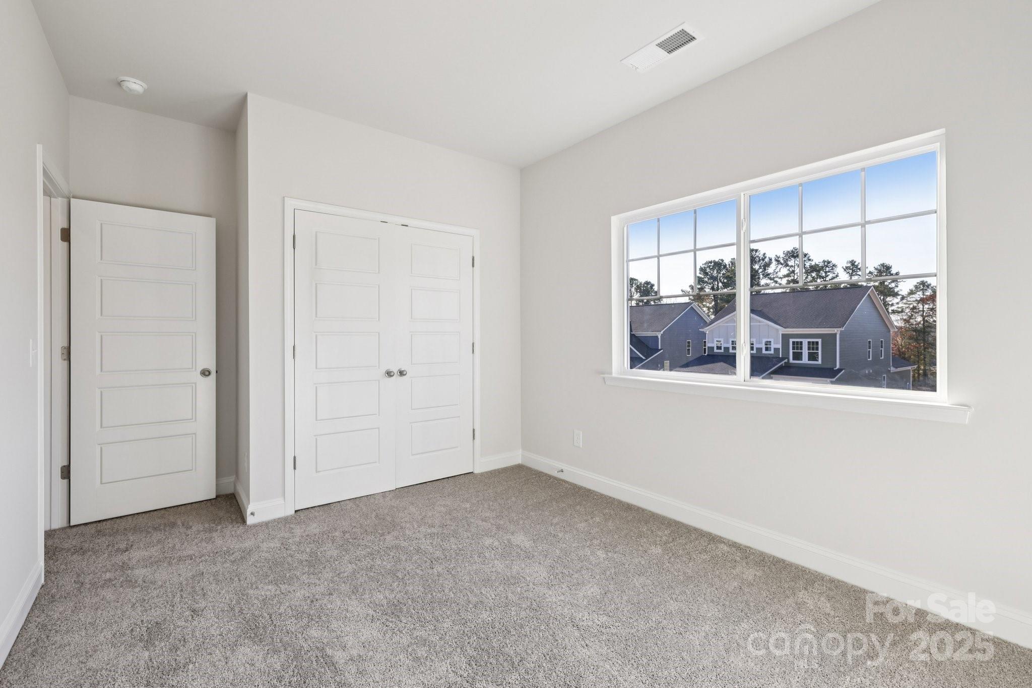 9612 Pointer Road, Unit 59 Huntersville, NC 28078 - Photo 25 of 43 a view of a room that has a window in it