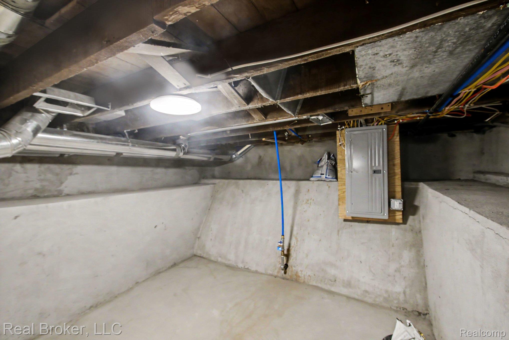 217 East Edgar Bergen Boulevard Decatur, MI 49045 - Photo 13 of 16 Exposed ceiling joists with visible electrical conduit and PVC piping