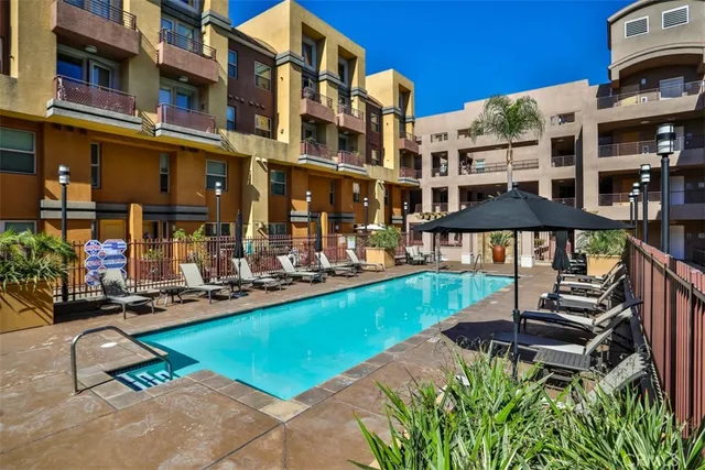 a view of a patio with swimming pool table and chairs
