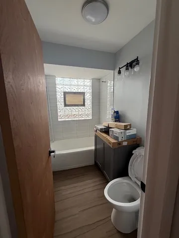 a bathroom with a toilet a sink and bathtub