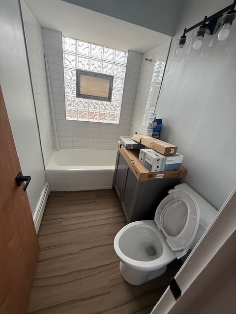 3537 South Harlem Avenue, Unit 2F Berwyn, IL 60402 - Photo 15 of 18 a bathroom with a toilet a sink and bathtub