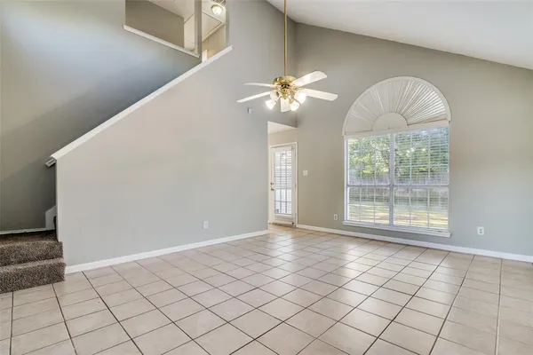 a view of an empty room with windows