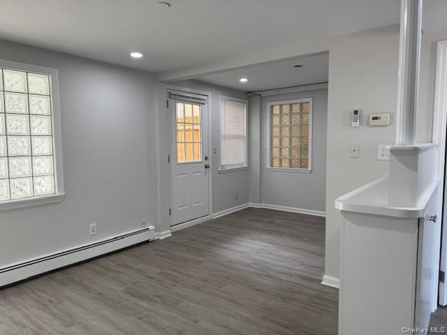 34 Main Street, Unit 2 Dobbs Ferry, NY 10522 - Photo 19 of 21 an empty room with wooden floor and windows