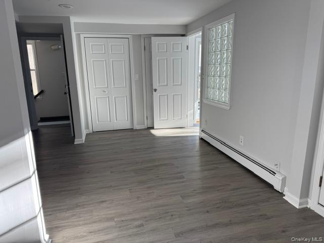 34 Main Street, Unit 2 Dobbs Ferry, NY 10522 - Photo 4 of 21 wooden floor in an empty room with a window