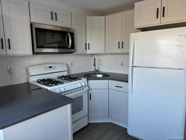 34 Main Street, Unit 2 Dobbs Ferry, NY 10522 - Photo 6 of 21 a kitchen with a refrigerator stove and microwave