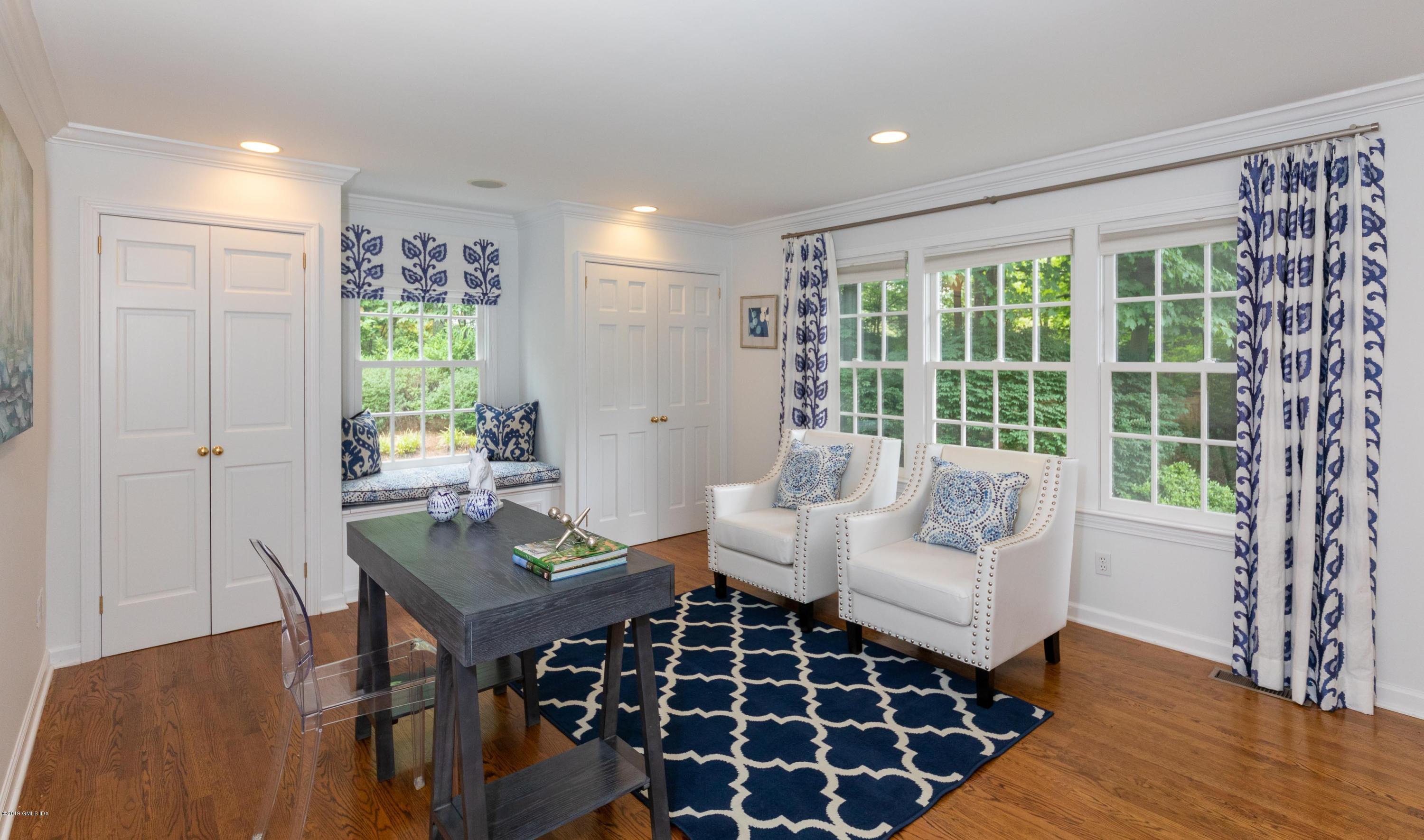 178 Cat Rock Road Cos Cob, CT 06807 - Photo 12 of 26 a living room with furniture and a large window