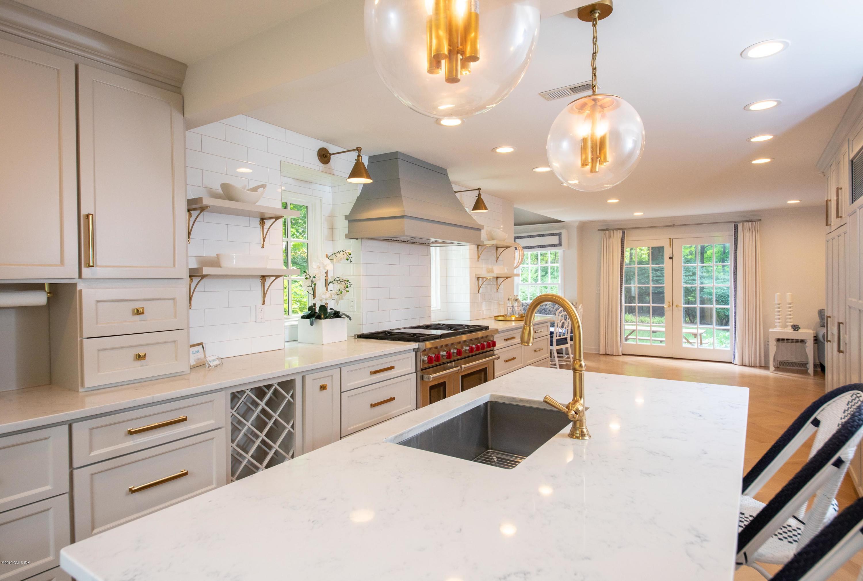 178 Cat Rock Road Cos Cob, CT 06807 - Photo 8 of 26 a kitchen with stove a sink and refrigerator