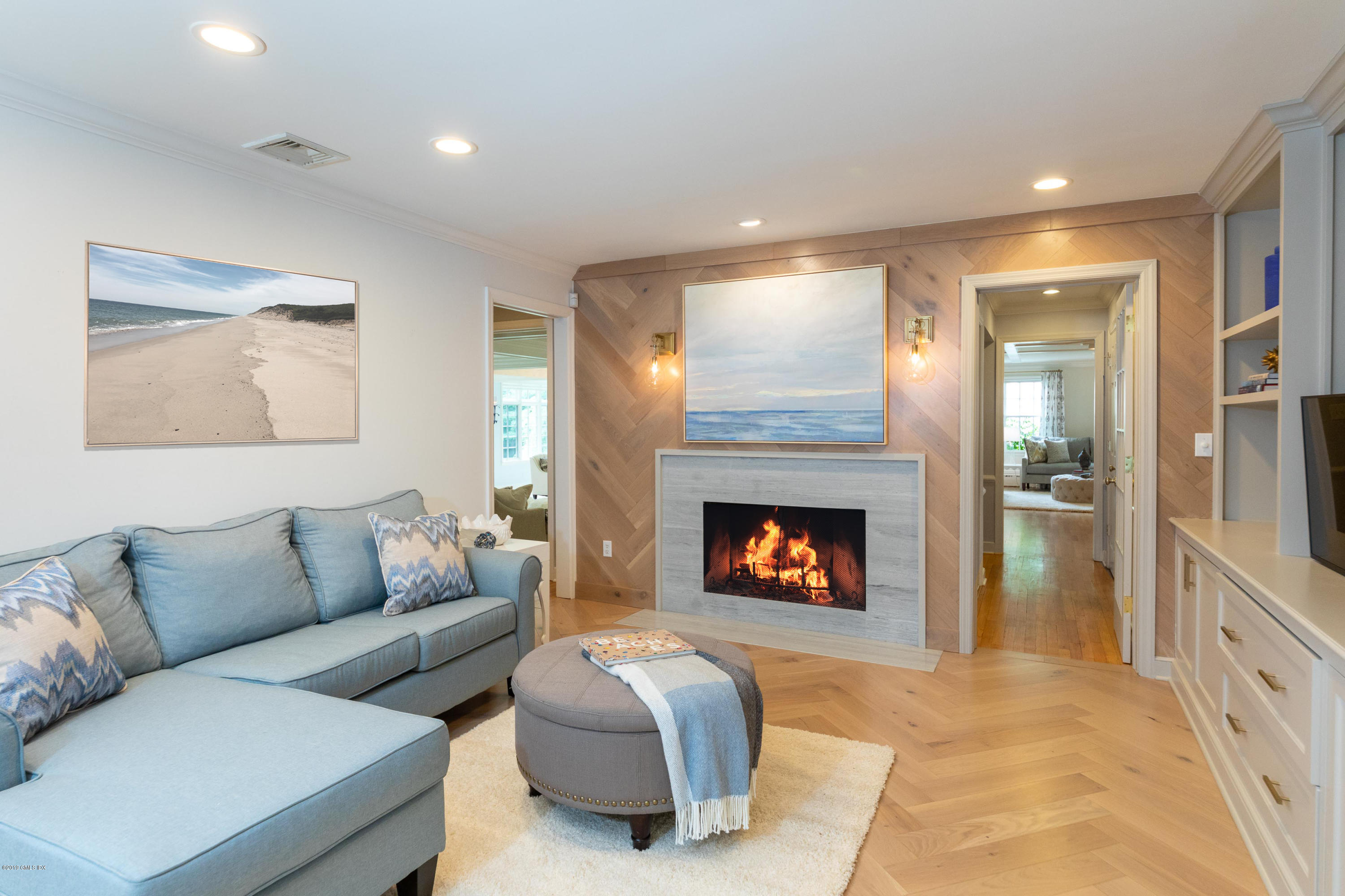 178 Cat Rock Road Cos Cob, CT 06807 - Photo 9 of 26 a living room with furniture and a fireplace