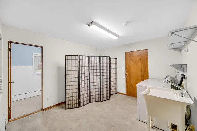 a view of a storage & utility room with closet window