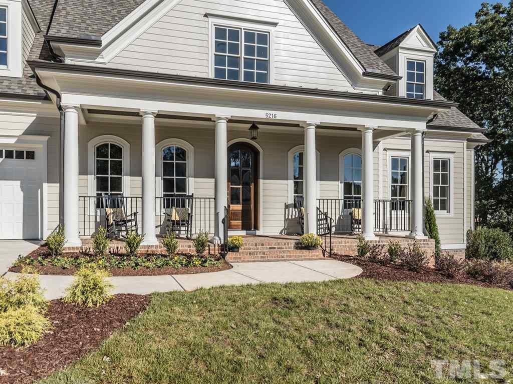 5216 Woodall Way, Unit 13 Raleigh, NC 27613 - Photo 2 of 25 front view of a house with a yard