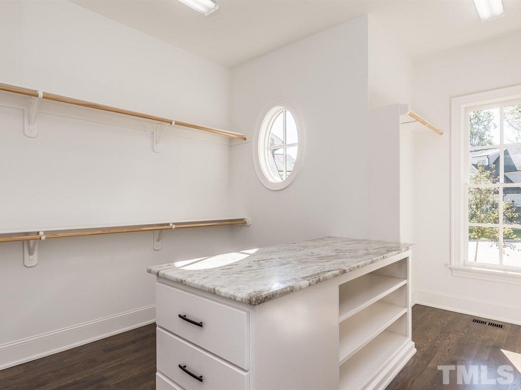 5216 Woodall Way, Unit 13 Raleigh, NC 27613 - Photo 14 of 25 a view of a kitchen cabinets and wooden floor
