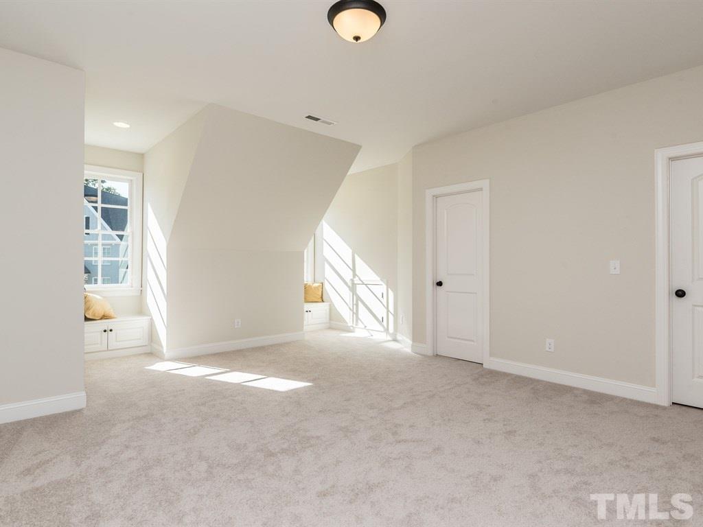 5216 Woodall Way, Unit 13 Raleigh, NC 27613 - Photo 16 of 25 a view of a livingroom with wooden floor and window
