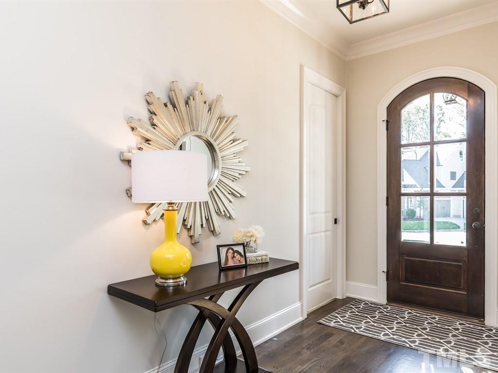 5216 Woodall Way, Unit 13 Raleigh, NC 27613 - Photo 3 of 25 a view of hall way with furniture and chandelier