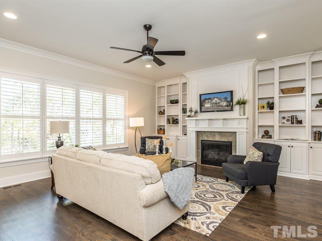 5216 Woodall Way, Unit 13 Raleigh, NC 27613 - Photo 5 of 25 a living room with furniture fireplace and window