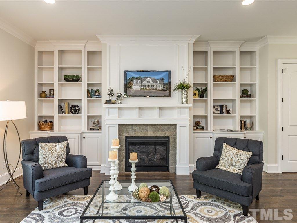 5216 Woodall Way, Unit 13 Raleigh, NC 27613 - Photo 6 of 25 a living room with furniture and a fireplace