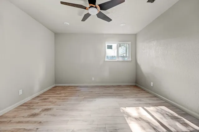 a view of an empty room with a window
