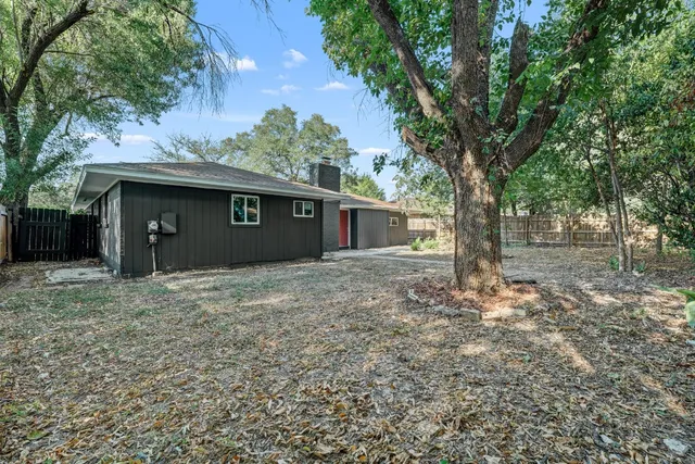 a house with trees in front of it