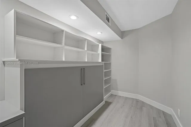 a view of an empty walk in closet