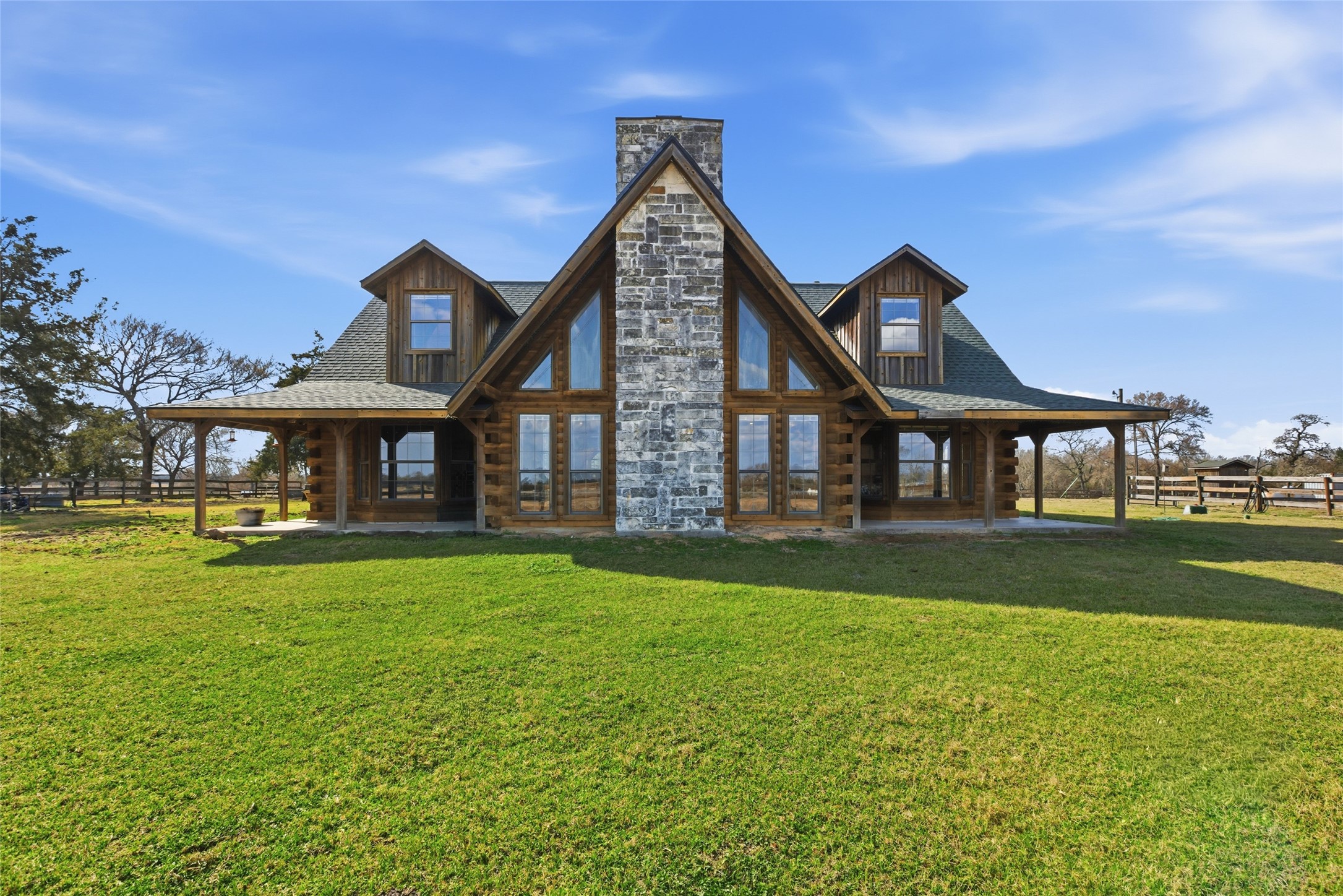 27185 Muckelroy Road Hempstead, TX 77445 - Photo 5 of 48 a front view of a house with a garden