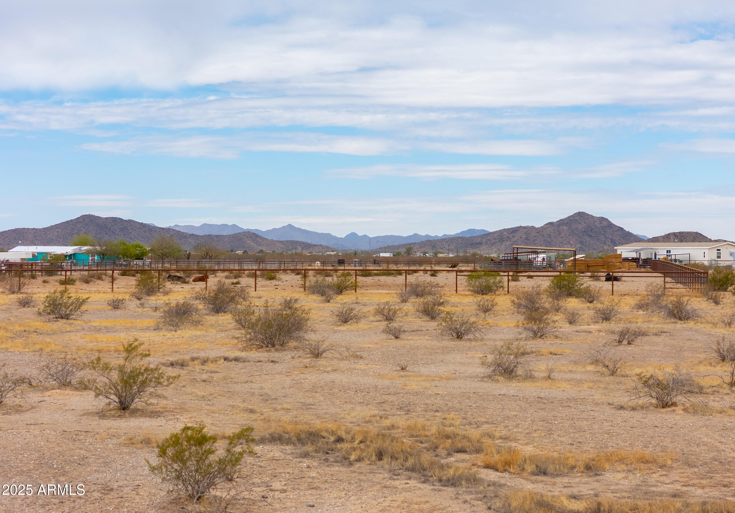 7640 North La Burma Road Maricopa, AZ 85139 - Photo 4 of 20 a view of a lake with houses in the back