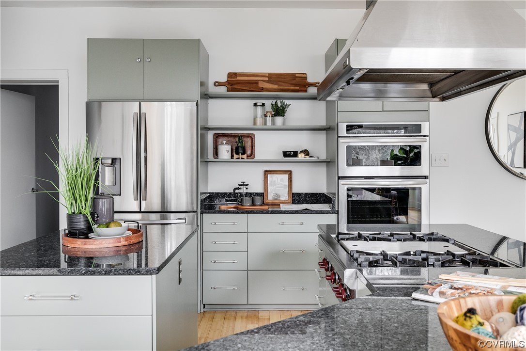 8312 Gwinnett Road Henrico, VA 23229 - Photo 12 of 50 a kitchen with stainless steel appliances granite countertop a stove a refrigerator and a sink