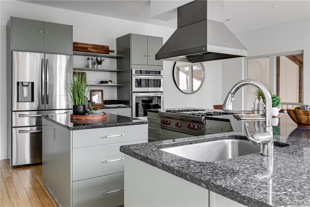 8312 Gwinnett Road Henrico, VA 23229 - Photo 13 of 50 a kitchen with stainless steel appliances granite countertop a sink stove and refrigerator