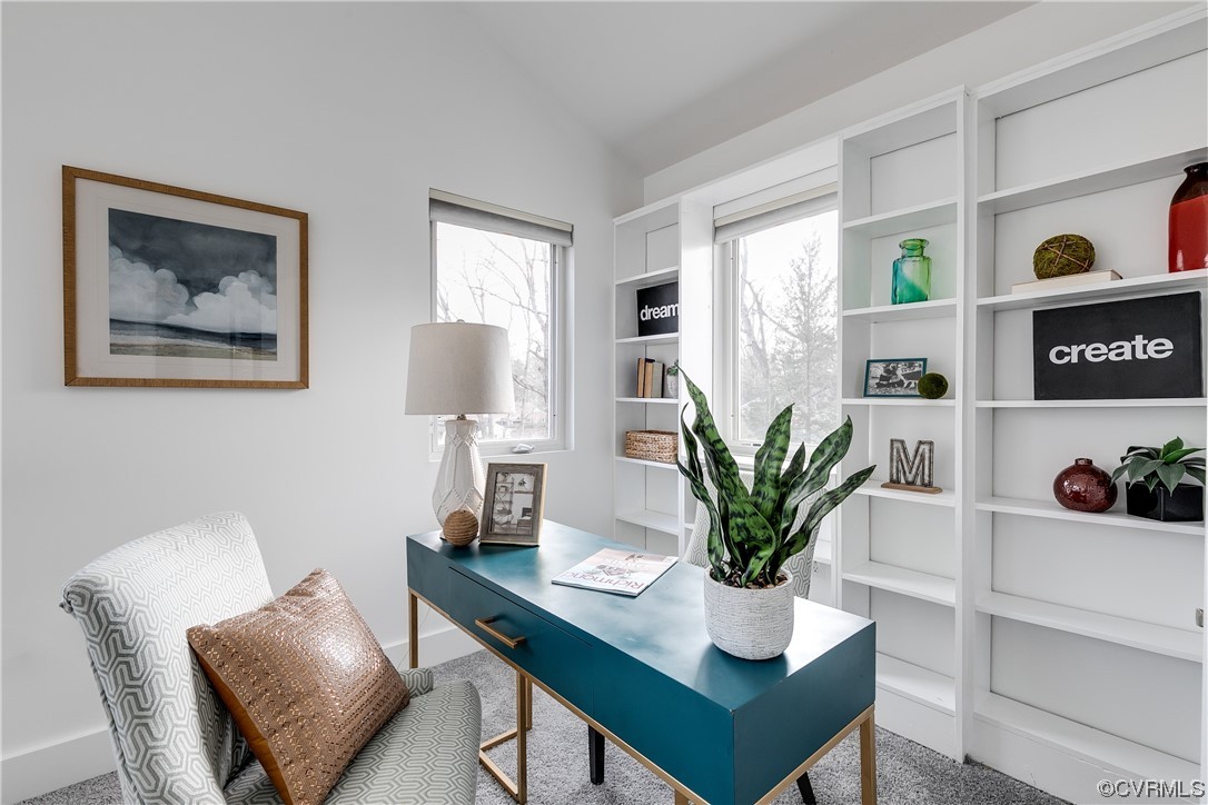 8312 Gwinnett Road Henrico, VA 23229 - Photo 21 of 50 a view of a workspace with furniture and a potted plant