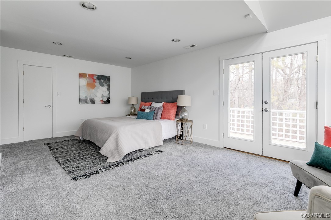 8312 Gwinnett Road Henrico, VA 23229 - Photo 23 of 50 a spacious bedroom with a bed and a large window