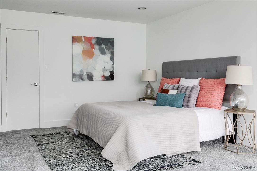 8312 Gwinnett Road Henrico, VA 23229 - Photo 24 of 50 a bedroom with a bed and a painting on the wall