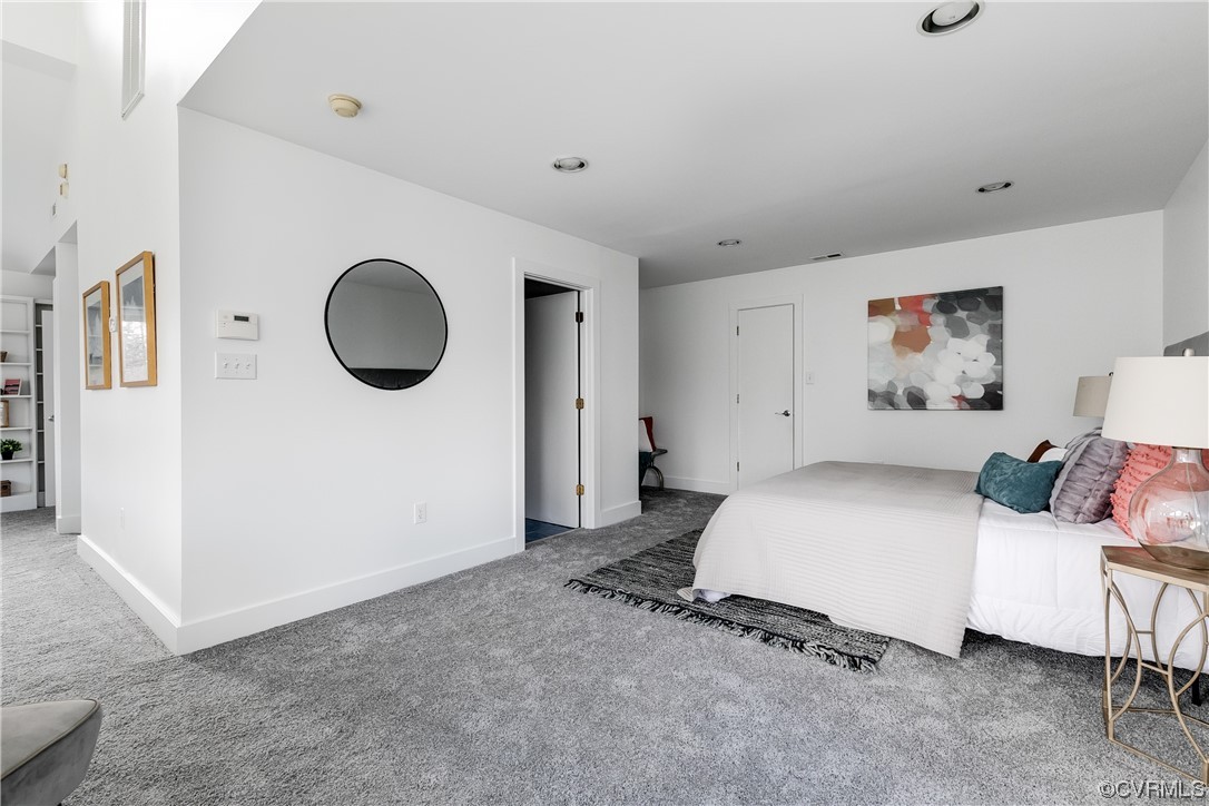 8312 Gwinnett Road Henrico, VA 23229 - Photo 25 of 50 a bedroom with a bed and a cabinets