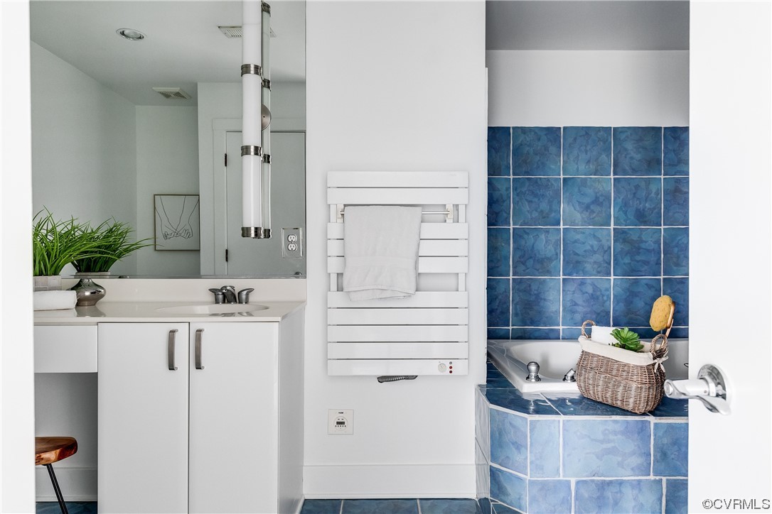 8312 Gwinnett Road Henrico, VA 23229 - Photo 27 of 50 a bathroom with a sink and a mirror